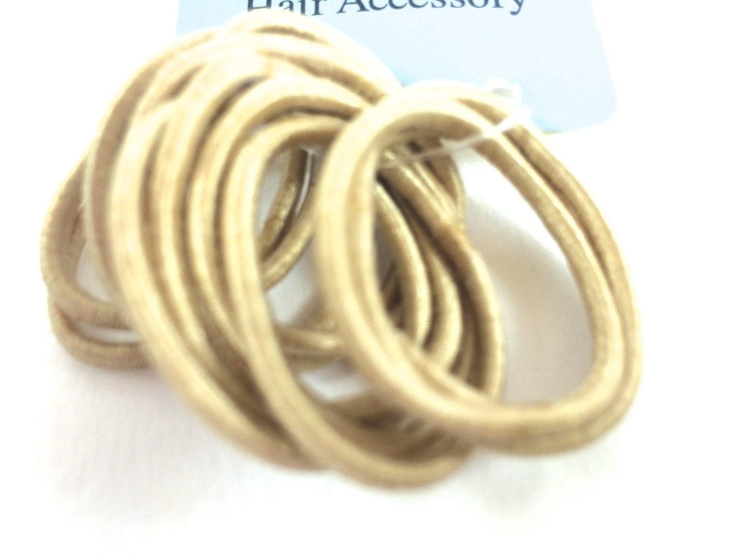 Blonde hair elastics in a pack of 12. Small, thin snag free bobbles.